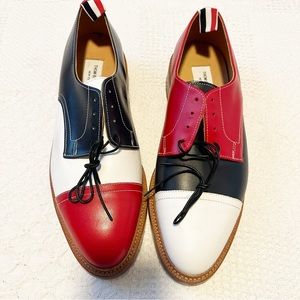 Thom Browne New York PEBBLED LEATHER SPECTATOR BROGUES.